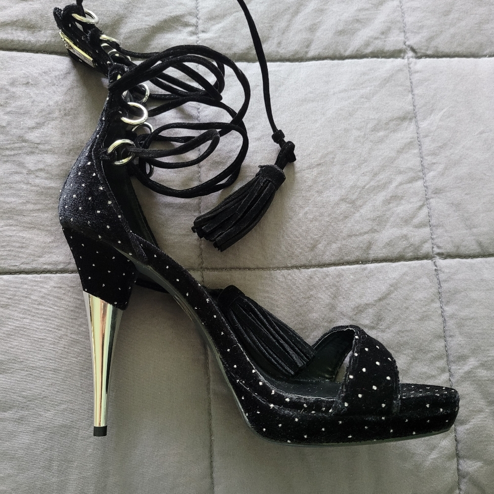 Collin Stuart black tasseled straps stilettos.